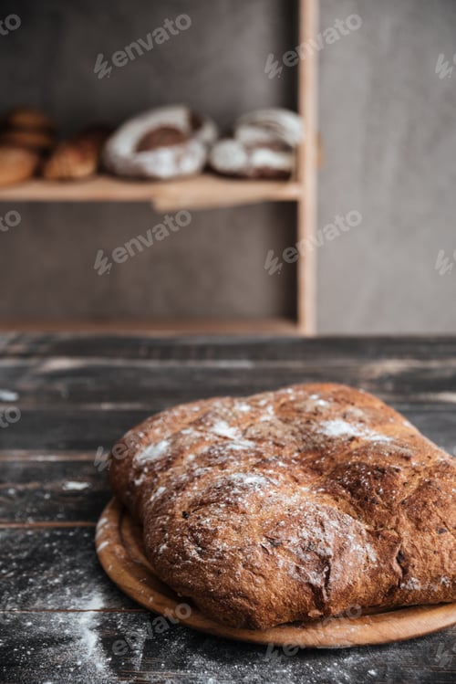Preview: Photo Of Bread With Flour On Dark Wooden Table At Bakery