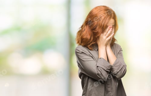 Preview: Young Beautiful Woman Over Isolated Background With Sad Expression Covering Face With Hands While