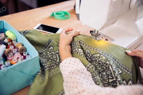 Preview: Closeup Portrait Of A Young Girl Using A Sewing Machine