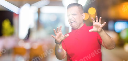Preview: Middle Age Arab Man Over Isolated Background Afraid And Terrified With Fear Expression Stop Gesture