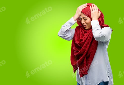 Preview: Young Arab Woman Wearing Hijab Terrified And Nervous Expressing Anxiety And Panic Gesture