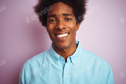 Preview: Young American Man With Afro Hair Wearing Blue Shirt Standing Over Isolated Pink Background With A