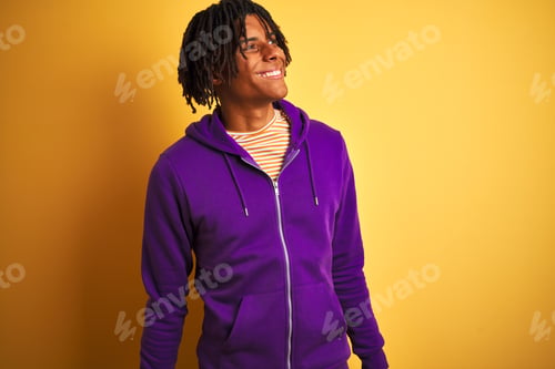 Preview: Afro American Man With Dreadlocks Wearing Purple Sweatshirt Over Isolated Purple Background Looking