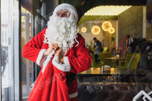 Preview: Santa Ties His Bag With Gifts. Christmas Celebration, Miracle, Gift To Good And Nice Children