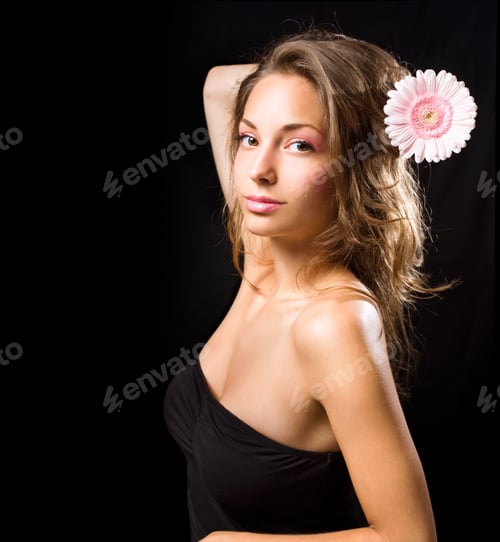 Preview: Elegant Beauty Shot Of Young Brunette With Flower, On Black Background.