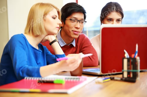 Preview: Smiling Students Working On Laptop Together