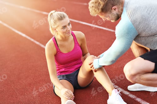 Preview: Man And Woman Racing On Outdoor Track