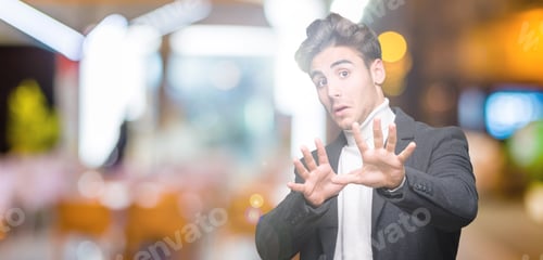 Preview: Young Elegant Man Wearing Winter Coat Over Isolated Background Afraid And Terrified With Fear