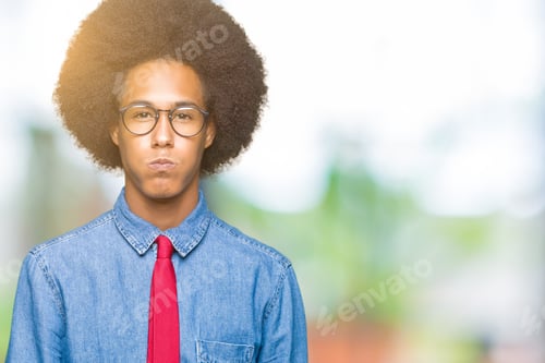 Preview: Young African American Business Man With Afro Hair Wearing Glasses And Red Tie Puffing Cheeks With
