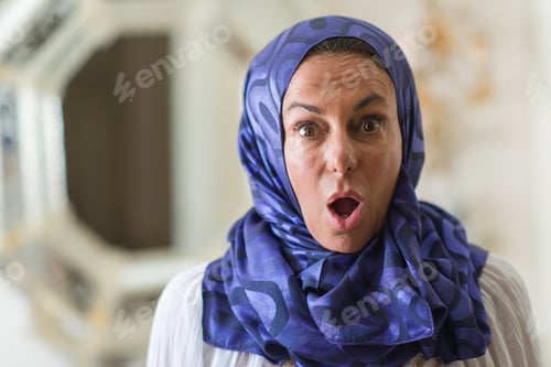 Preview: Middle Age Brunette Arabian Woman Wearing Colorful Hijab Scared In Shock With A Surprise Face