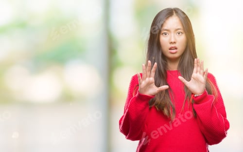 Preview: Young Asian Woman Wearing Winter Sweater Over Isolated Background Afraid And Terrified With Fear