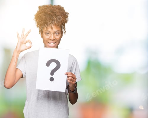 Preview: Young African American Woman Holding Paper With Question Mark Over Isolated Background Doing Ok