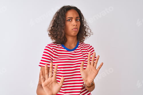 Preview: Young Brazilian Woman Wearing Red Striped T-Shirt Standing Over Isolated White Background Moving