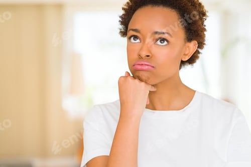 Preview: Young Beautiful African American Woman Wearing Casual White T-Shirt Thinking Looking Tired And