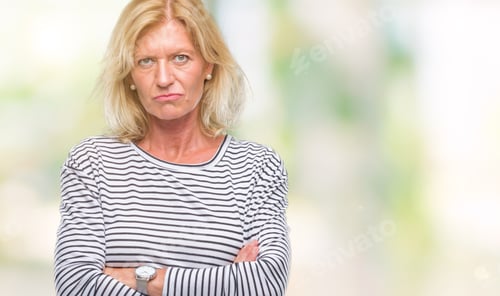 Preview: Middle Age Blonde Woman Over Isolated Background Skeptic And Nervous, Disapproving Expression On