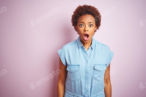 Preview: Young Beautiful African American Woman With Afro Hair Over Isolated Pink Background Afraid And