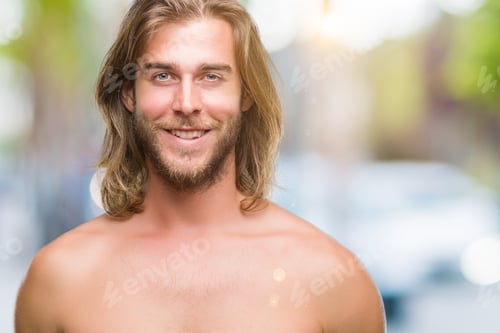 Preview: Young Handsome Shirtless Man With Long Hair Showing Sexy Body Over Isolated Background With A Happy