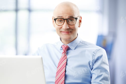 Preview: Portrait Of Busy Businessman Sitting Office. Senior Professional Using Laptop While Looking At