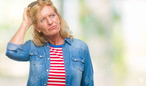 Preview: Middle Age Blonde Woman Over Isolated Background Confuse And Wonder About Question. Uncertain With