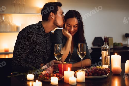 Preview: Beautiful Passionate Couple Having A Romantic Candlelight Dinner At Home, Kissing