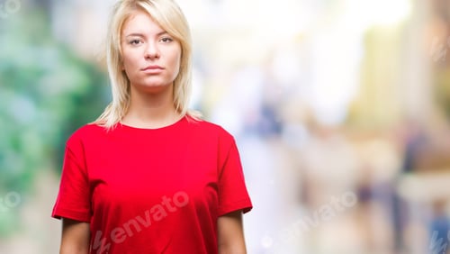 Preview: Young Beautiful Blonde Woman Wearing Red T-Shirt Over Isolated Background With Serious Expression