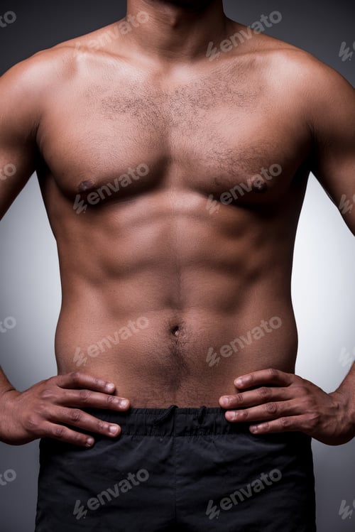 Preview: Perfect Male Body. Close-Up Of Shirtless African Man Holding Hands On Hip While Standing Against