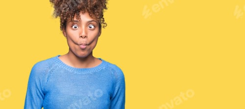 Preview: Beautiful Young African American Woman Over Isolated Background Making Fish Face With Lips, Crazy