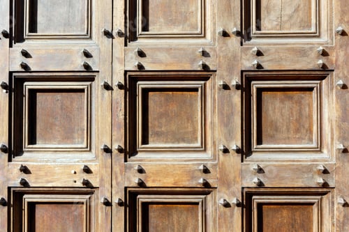 Preview: Brown Wooden Door Abstract Studded With Iron Nails Or Bolts
