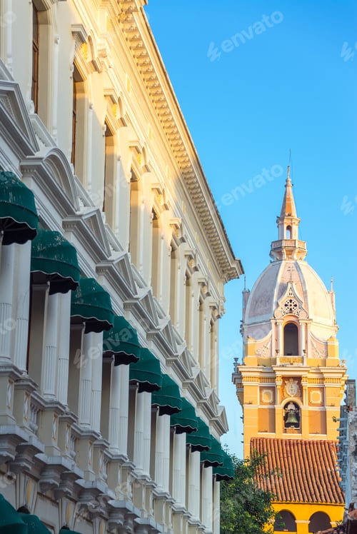 Preview: Spire Of The Cathedral In Cartagena, Colombia With A White Historic Colonial Building Also Visible