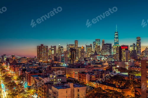 Preview: Lower Manhattan Skyscrapers At Sunset. Street With Cars And Brooklin Bridge On Horizon, New York