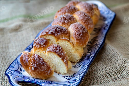 Preview: Sweet Twist Bread, Typical Of Brazilian Bakery, On Dish Decorated In Blue On Rustic Jute Tablecloth