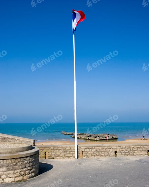Preview: French Flag Against A Blue Sky, At Normandy, France