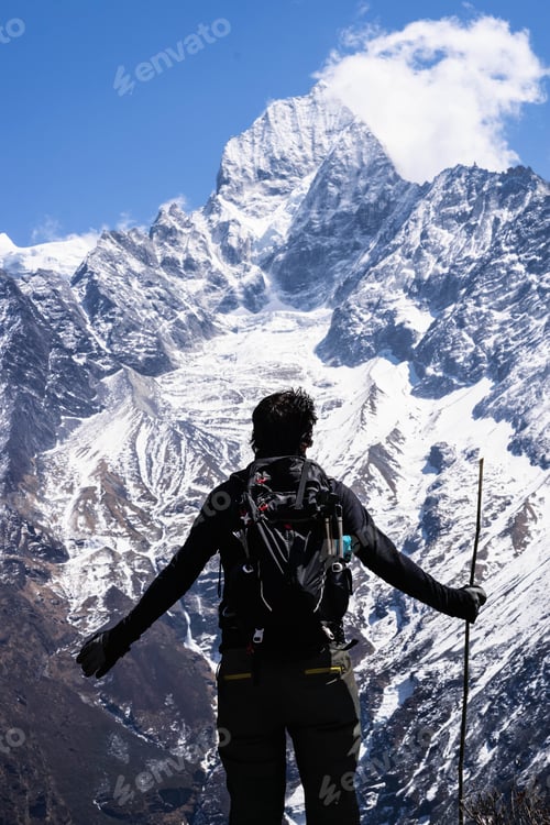 Preview: Man Standing In Front Of Majestic Thamserku Mountain, On The Trek To Everest, Nepal