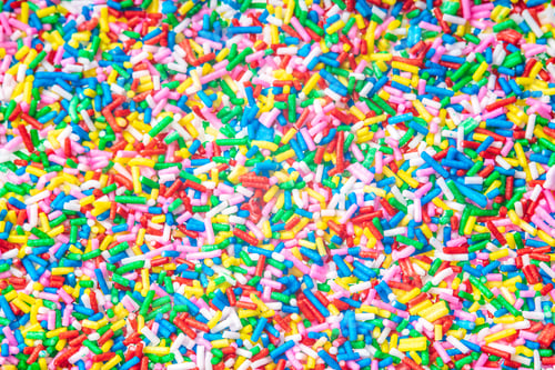 Preview: Colorful Candy Sprinkles Close Up For Birthday Cake On White Background