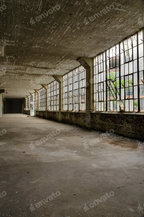 Preview: Vast Concrete Rooms And Large Windows Dominate The Scene At An Abandoned Clothing Factory.