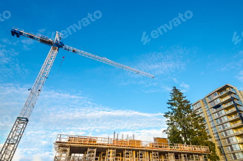 Preview: High-Rise Building Under Construction. The Site With Crane Against Blue Sky With White Clouds.