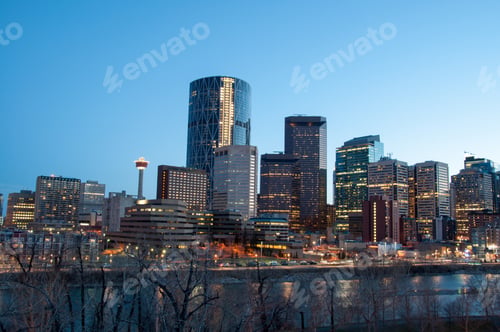 Preview: Calgary Skyline At Dusk, With Bow River In Foreground.