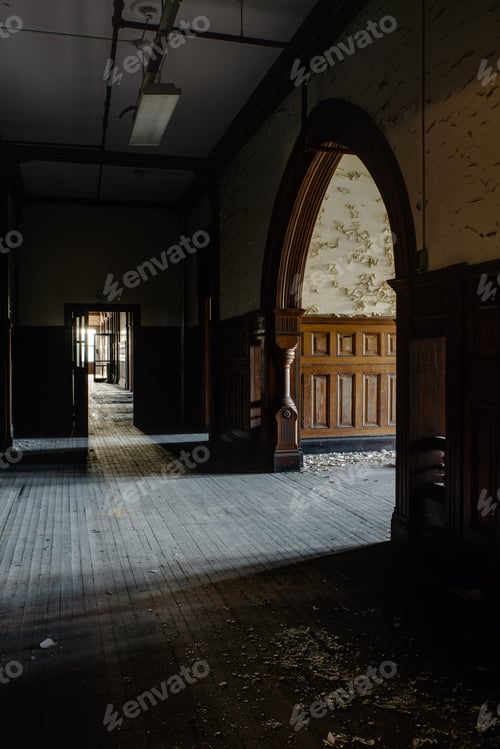 Preview: An Interior View Of A Beautiful Arched Entry Flanked By Wood Paneling And Hardwood Floors At An