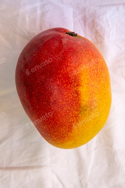Preview: Mango On White Wrinkled Tablecloth