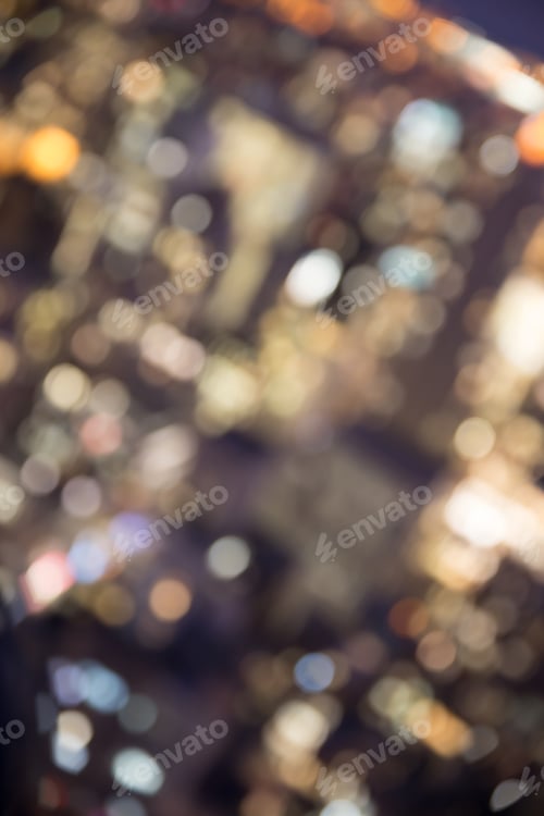 Vista previa: Defocused Abstract Metropolitan City Blur Of Buildings With Lens Flare Shot In New York City