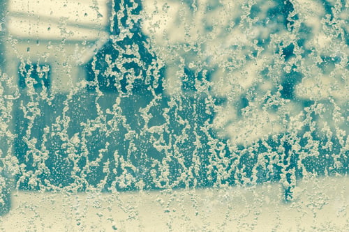 Preview: Toned Winter Window With Snow And Water Droplets