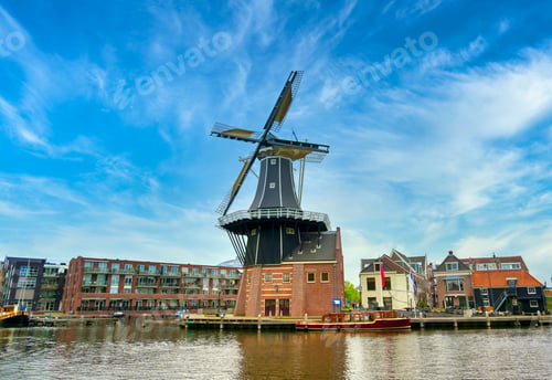 Preview: A Windmill Along The Canals In Haarlem, Netherlands On A Clear Day.