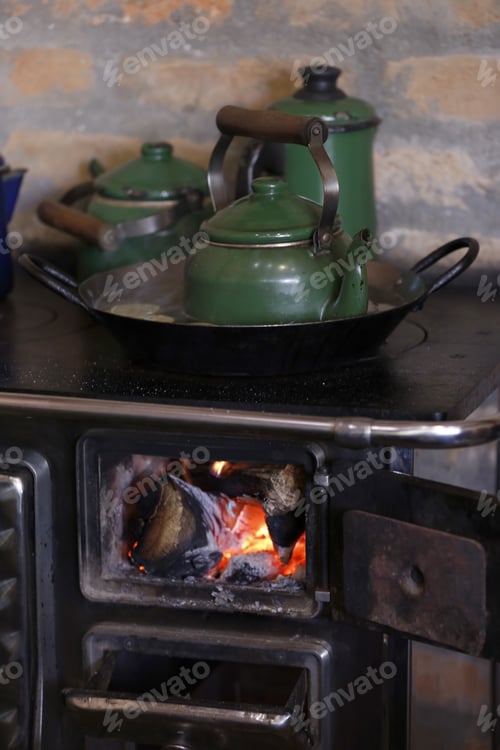 Preview: Warm Fire Heating A Coffee Kettle In Wood Burning Stove. Traditional Style In Countryside Of Brazil