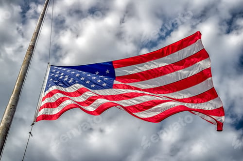 Preview: American Flag At Half-Mast Or Half-Staff Blowing In Wind With Blue Sky And Clouds.