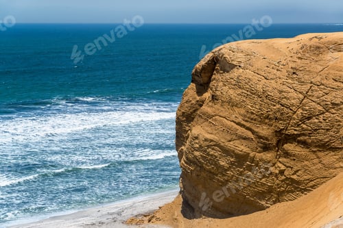 Preview: Dry Barren Desert Rock With Pacific Ocean In The Background In Paracas, Peru