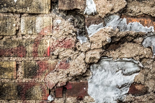 Preview: Grungy Old Brick And Cement Wall Heavily Cracked And Repaired
