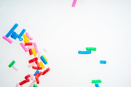 Preview: Colorful Candy Sprinkles Close Up For Birthday Cake On White Background