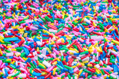 Preview: Colorful Candy Sprinkles Close Up For Birthday Cake On White Background