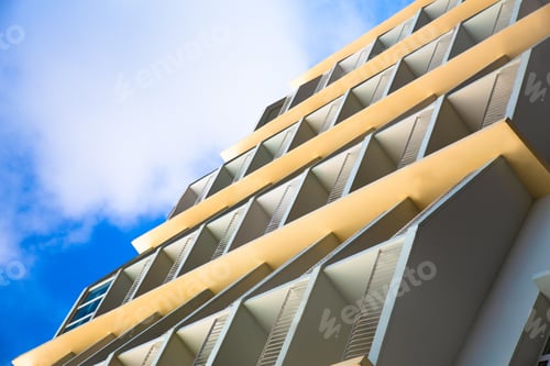 Preview: Contemporary Hotel Painted Yellow With Balconies