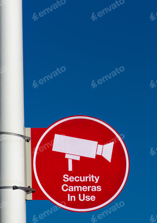 Preview: Red Security Cameras In Use Sign In American Mall Parking Lot In Vertical